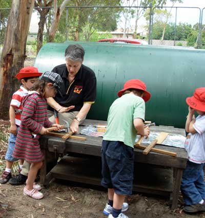 With children doing carpentry